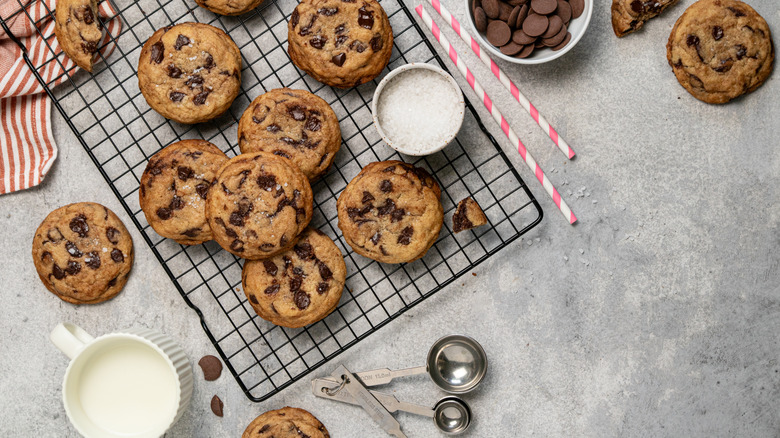 Chocolate chip cookies and ingredients on a countertop