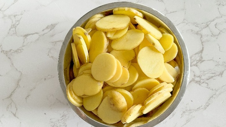 sliced potatoes in bowl