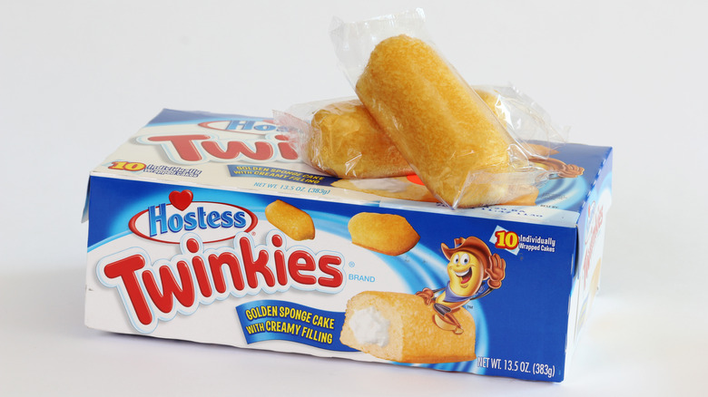 Two twinkies on top of twinkies box