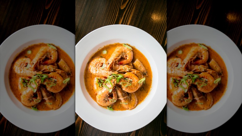 Plate of New Orleans barbecue shrimp on table