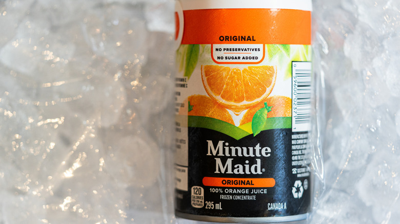 A can of Minute Maid orange juice concentrate on top of a bag of ice