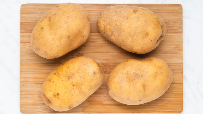 potatoes on cutting board