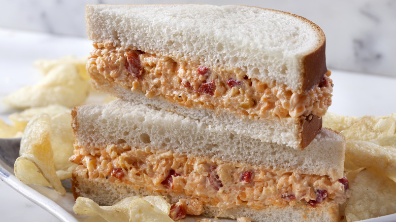 Pimento cheese sandwich on white bread with chips