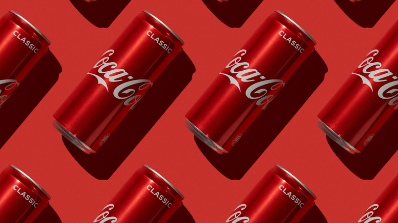 coke cans on red background