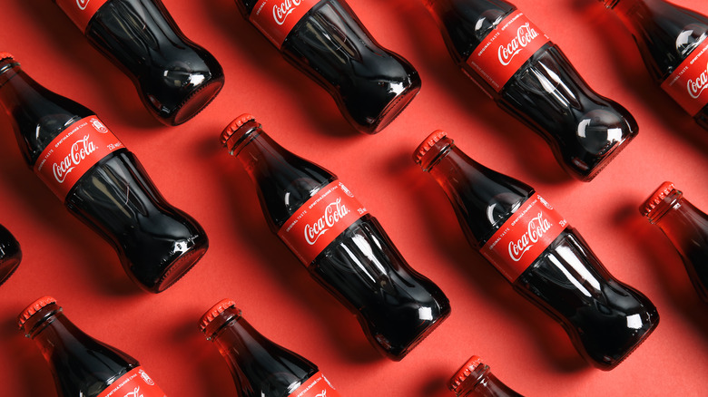 Coca-Cola bottles on red background