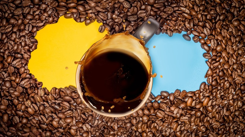 Coffee and beans with yellow and blue background