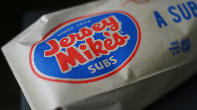 A Jersey Mike's sub in paper wrapper