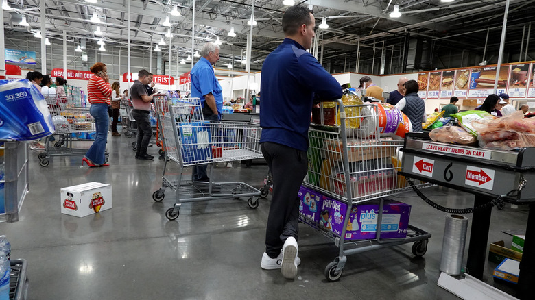 Customers in line at Costco checkout