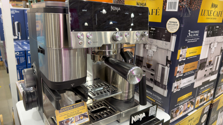 The Ninja deluxe 3-in-1 coffee maker surrounded by packaging