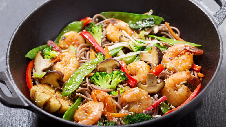 Noodles and shrimp in wok