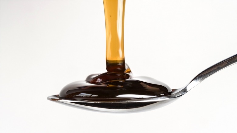 Corn syrup poured onto spoon