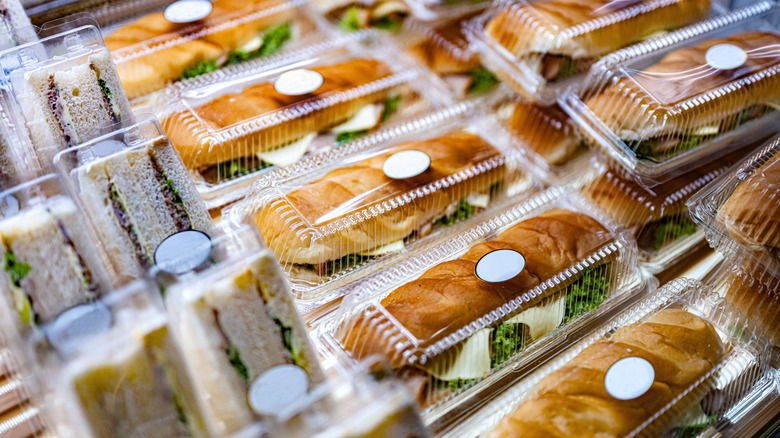 A variety of pre-packaged, grab-and-go sandwiches in clear plastic containers