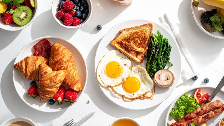 Breakfast foods on white plates