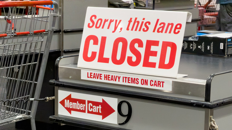 A "Sorry, this lane is closed" sign at Costco checkout