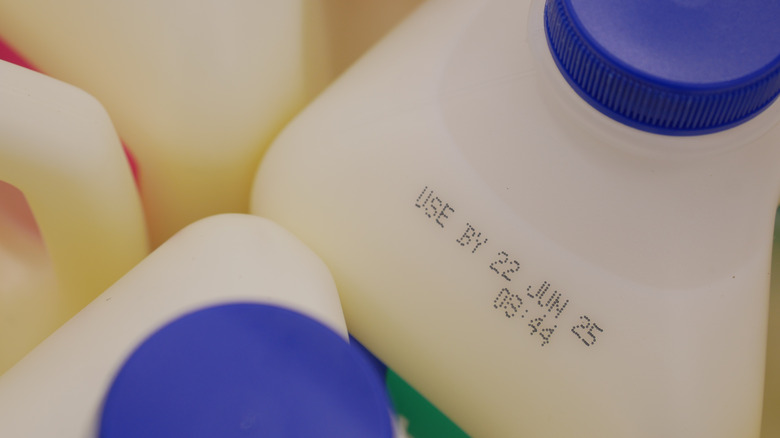 An expiration date on a container of milk