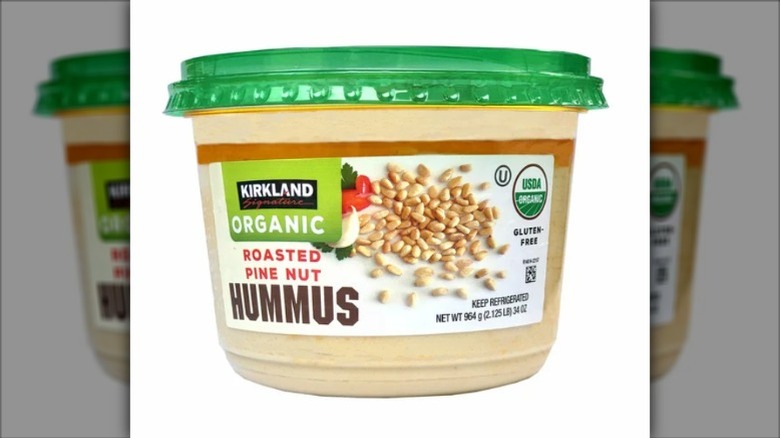 A container of Kirkland Signature Organic Roasted Pine Nut Hummus