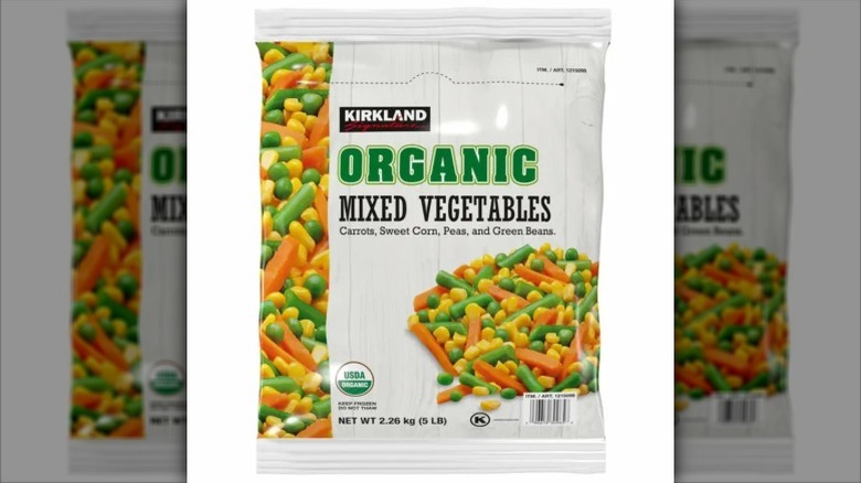 view of a bag of Kirkland Signature Organic Mixed Vegetables, depicting carrots, green beans, corn, and peas.