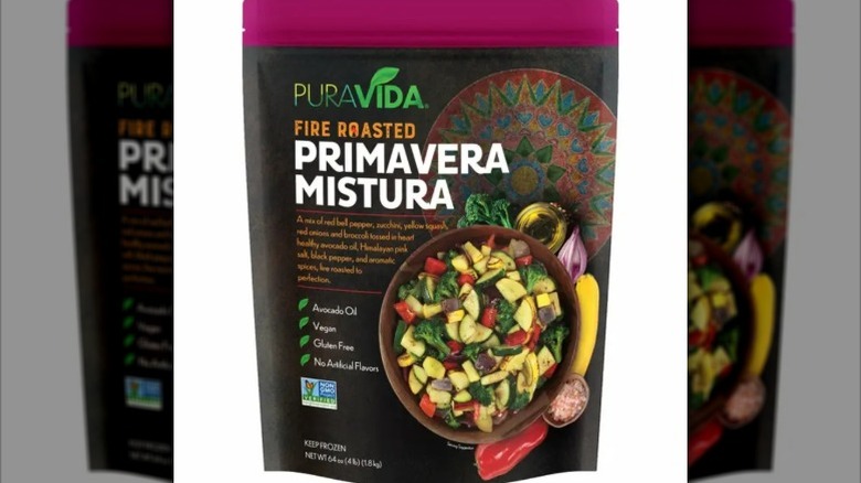 view of a bag of PuraVida Fire Roasted Primavera Mistura, depicting the veggie blend cooking in a skillet.