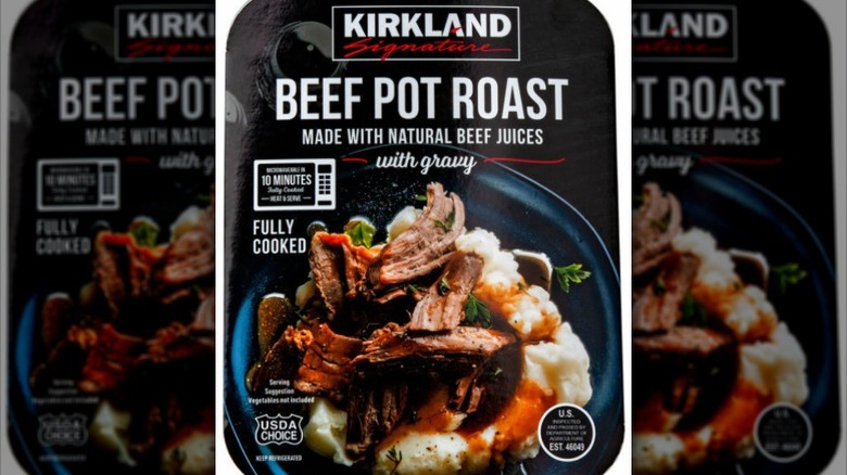 A closeup of a package of Kirkland Signature beef pot roast with gravy
