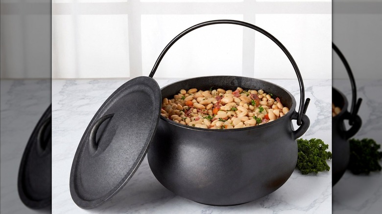 A cast iron pot full of beans