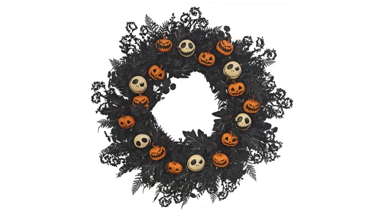 A black wreath with orange and white faces
