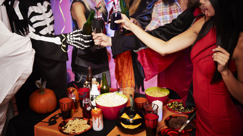 friends toasting at a Halloween party