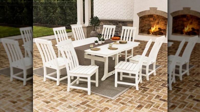 Prescott outdoor dining set by outside fireplace