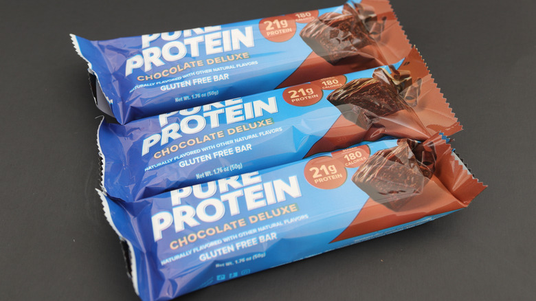 Three wrapped chocolate deluxe Pure Protein bars