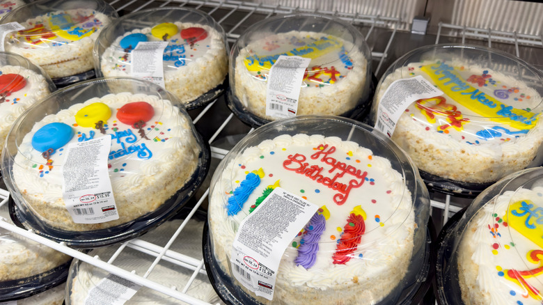 Decorated birthday cakes in the refrigerated case at Costco