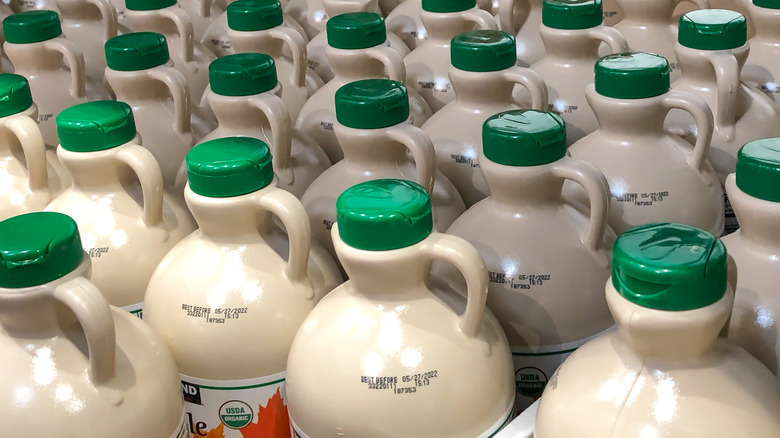Bottles of Costco's maple syrup with focus on the lids