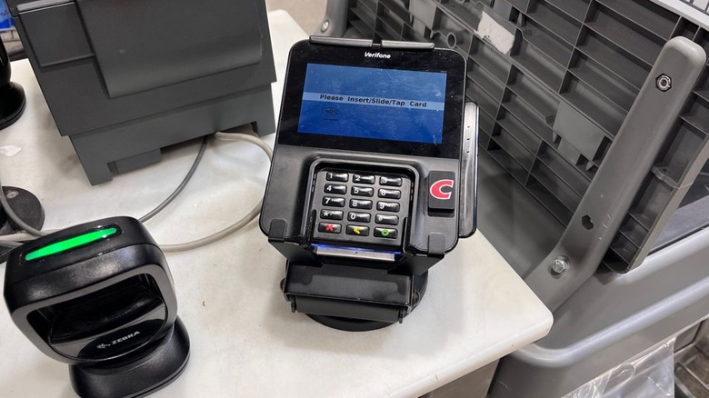 Checkout station at a Costco with a card reader