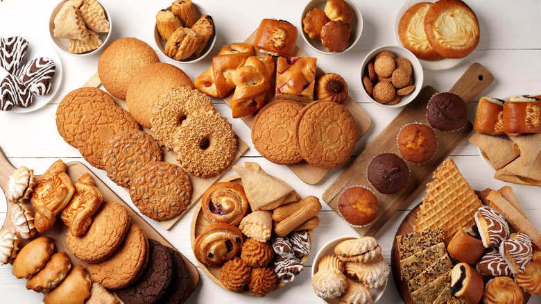 An assortment of baked goods lined up against a white background
