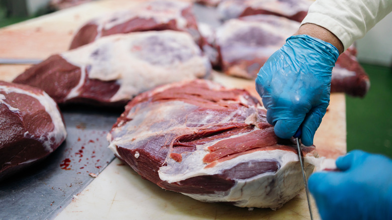 Meat being processed