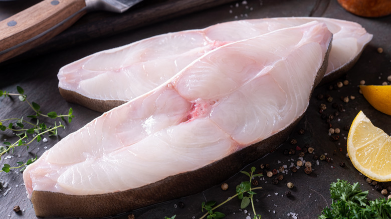 Raw halibut filets on board