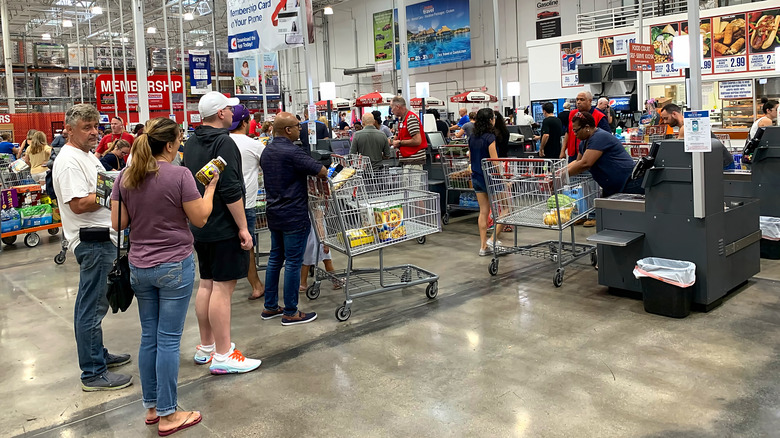 Costco shoppers line up at check out