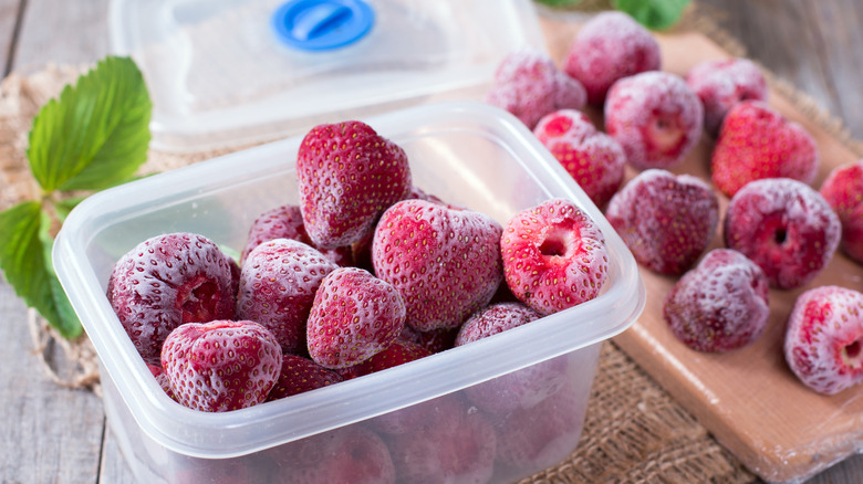 frozen strawberries in plastic container