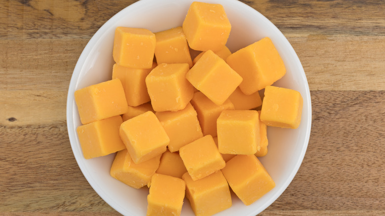 cubed cheddar cheese in a bowl