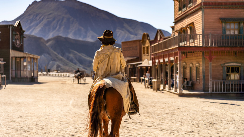 Two Old West outlaws in a gunfight