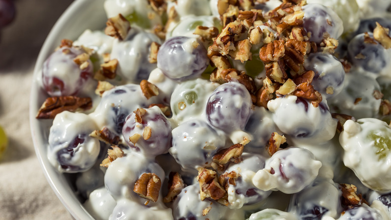 creamy grape salad with nuts in bowl