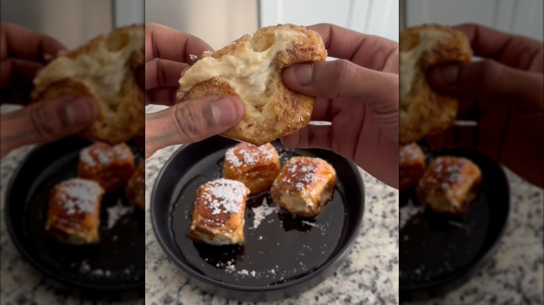 Pulling apart stuffed French toast Hawaiian rolls