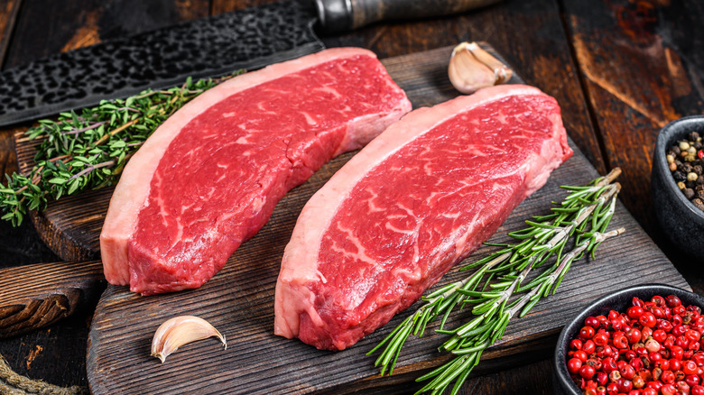 Two raw steaks