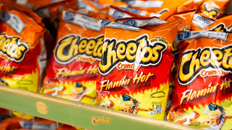 A lineup of Flamin' Hot Cheeto bags