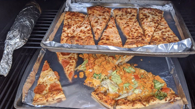 Casey's chees and taco pizza being reheated in an oven