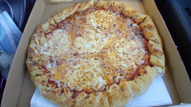 Full Pilot gas station three-cheese pizza in box