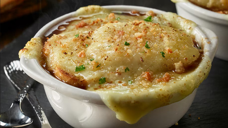 Close up image of the French Onion Soup in a white crock at Longhorn Steakhouse