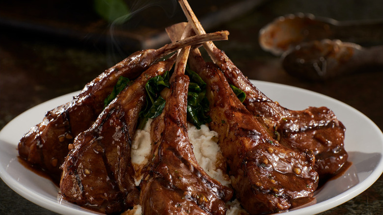 Close up of Grilled Lamb Chops on a white plate at Longhorn Steakhouse