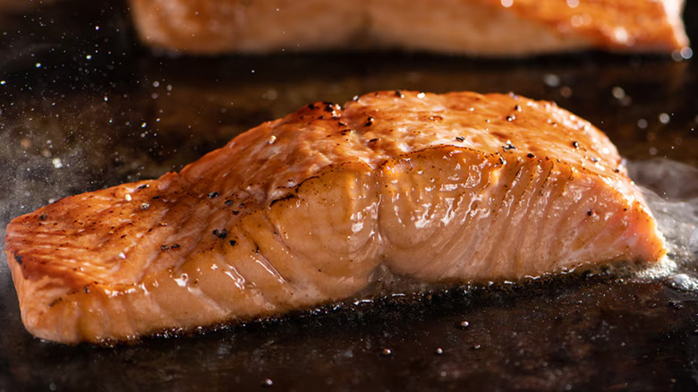 A close up image of the Longhorn Salmon on the grill at Longhorn Steakhouse