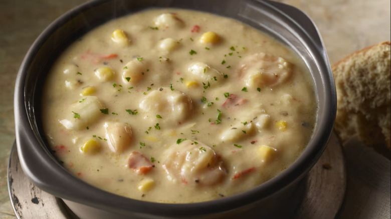 The Shrimp and Lobster Chowder in a black bowl at Longhorn Steakhouse