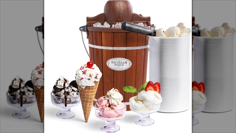 Nostalgia electric ice cream maker surrounded by various servings of ice cream
