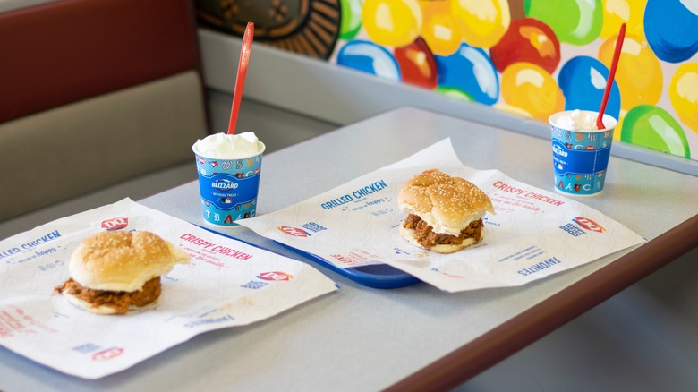 Dairy Queen table with trays of sandwiches and blizzards